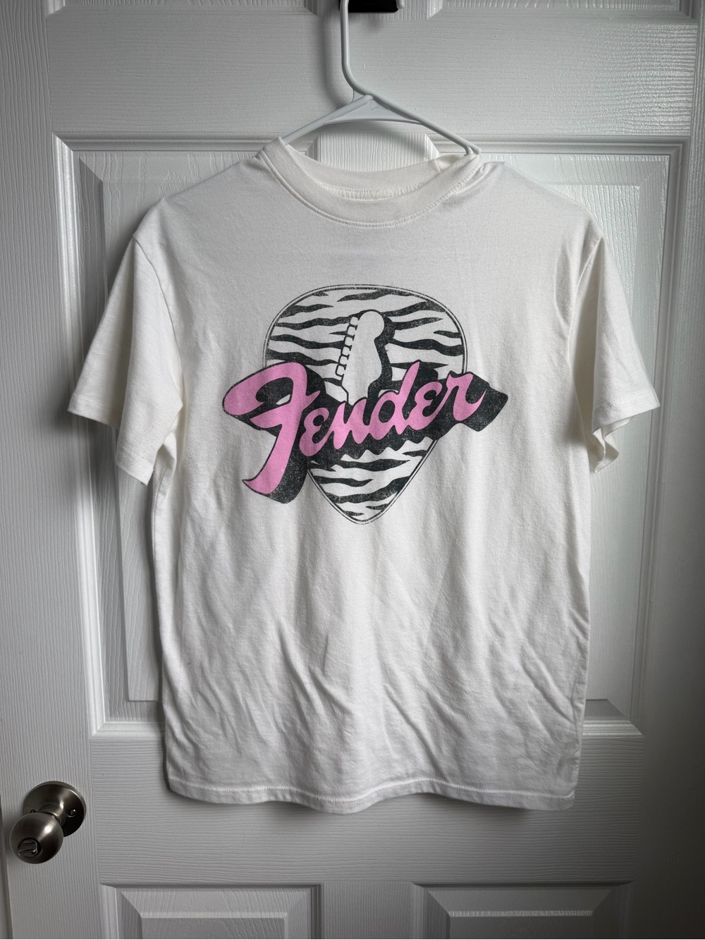 Fender White Tee with Pink Script Logo and Zebra Pick